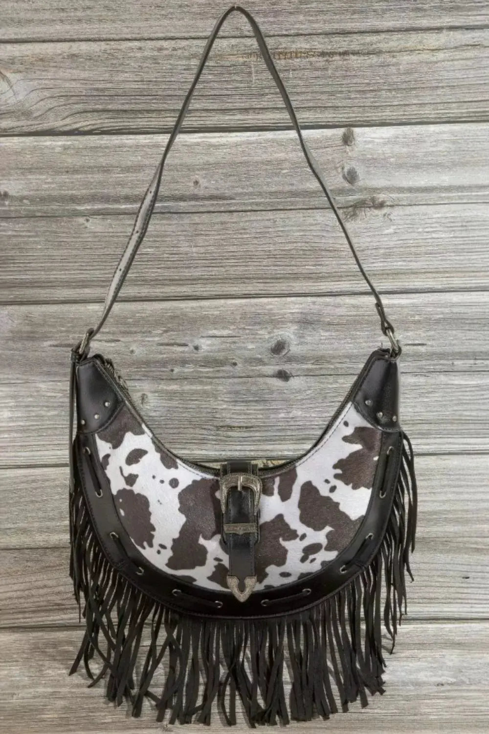 Fame Cow Print Faux Leather Fringe Hobo Bag by Fame