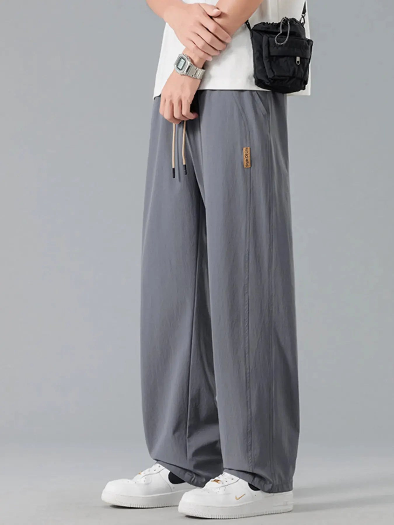 Men's Plus Size Loose Fit Drawstring Casual Pants by Trendsi