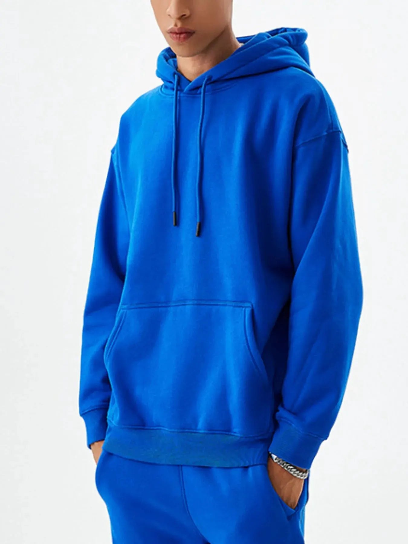 Men's Drawstring Kangaroo Pocket Long Sleeve Hoodie by Trendsi
