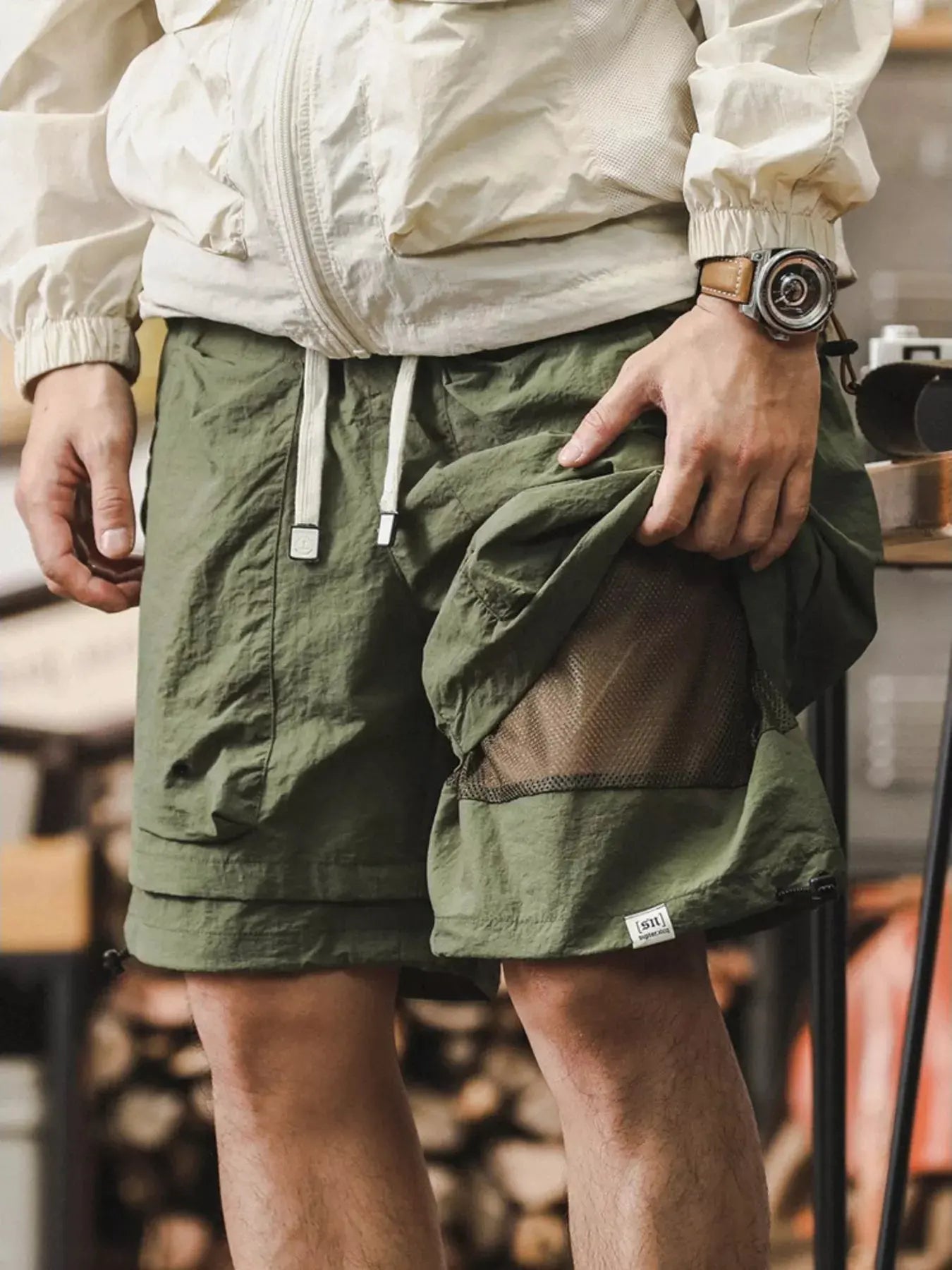 Men's Plus Size Multiple Pocket Layered Cargo Shorts with Drawstring Hem by Trendsi