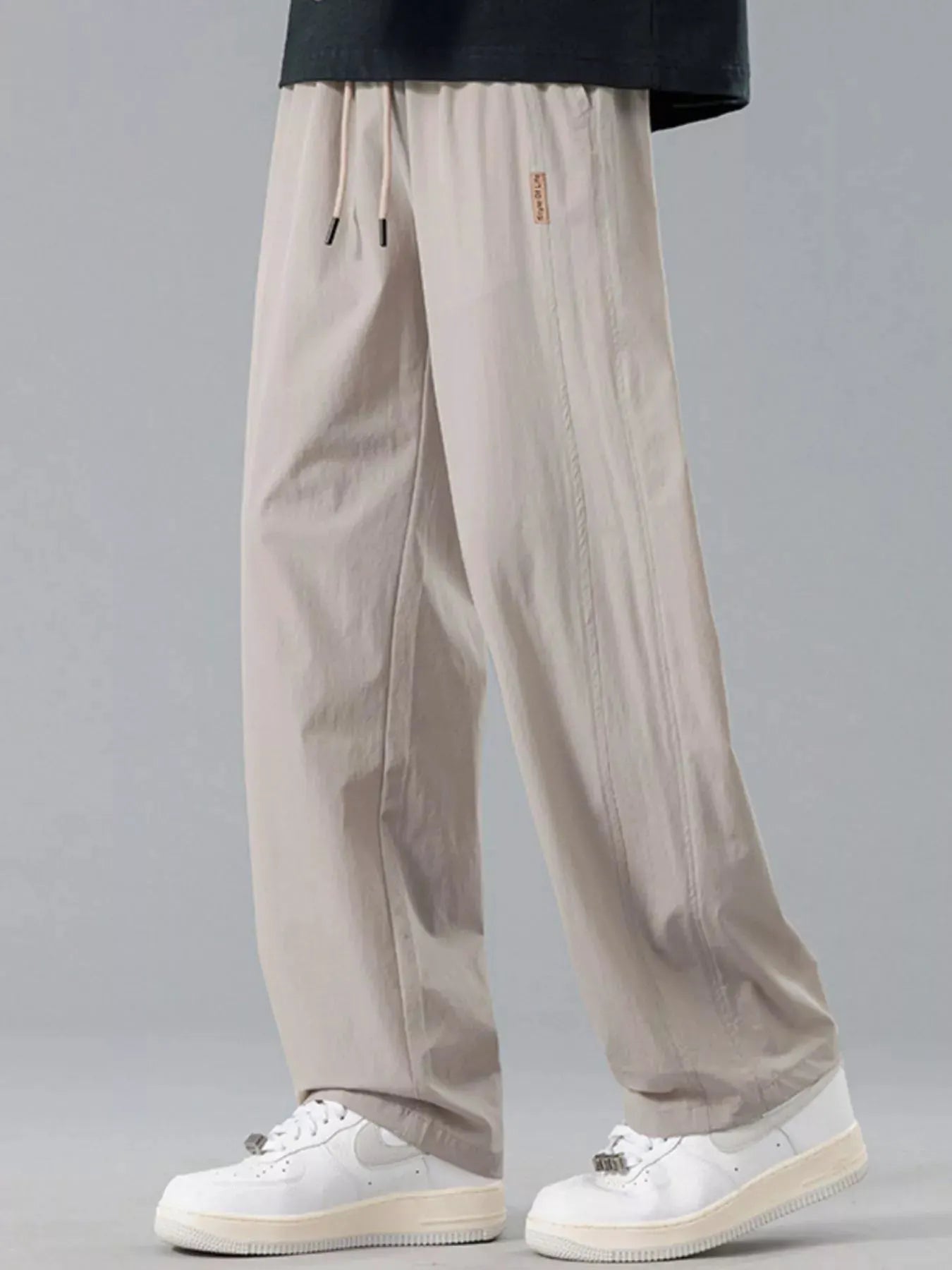 Men's Plus Size Loose Fit Drawstring Casual Pants by Trendsi