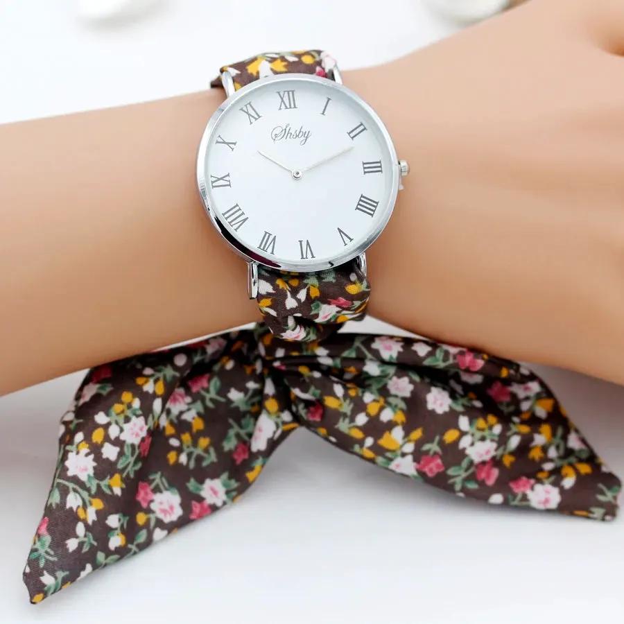 Shsby Brand New Lady Flower Cloth Wristwatch Roman Silver Women Dress Watch High Quality Fabric Watch Sweet Girls Bracelet Watch by Equanimity Essence.