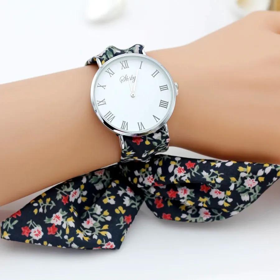 Shsby Brand New Lady Flower Cloth Wristwatch Roman Silver Women Dress Watch High Quality Fabric Watch Sweet Girls Bracelet Watch by Equanimity Essence.