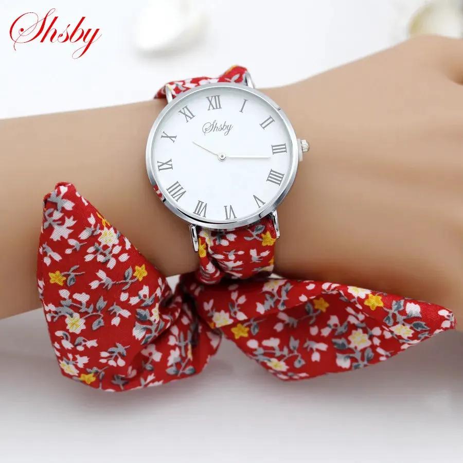 Shsby Brand New Lady Flower Cloth Wristwatch Roman Silver Women Dress Watch High Quality Fabric Watch Sweet Girls Bracelet Watch by Equanimity Essence.