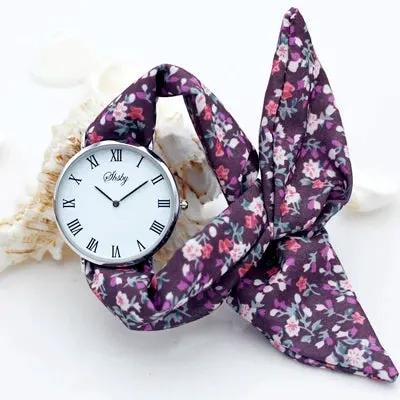 Shsby Brand New Lady Flower Cloth Wristwatch Roman Silver Women Dress Watch High Quality Fabric Watch Sweet Girls Bracelet Watch by Equanimity Essence.