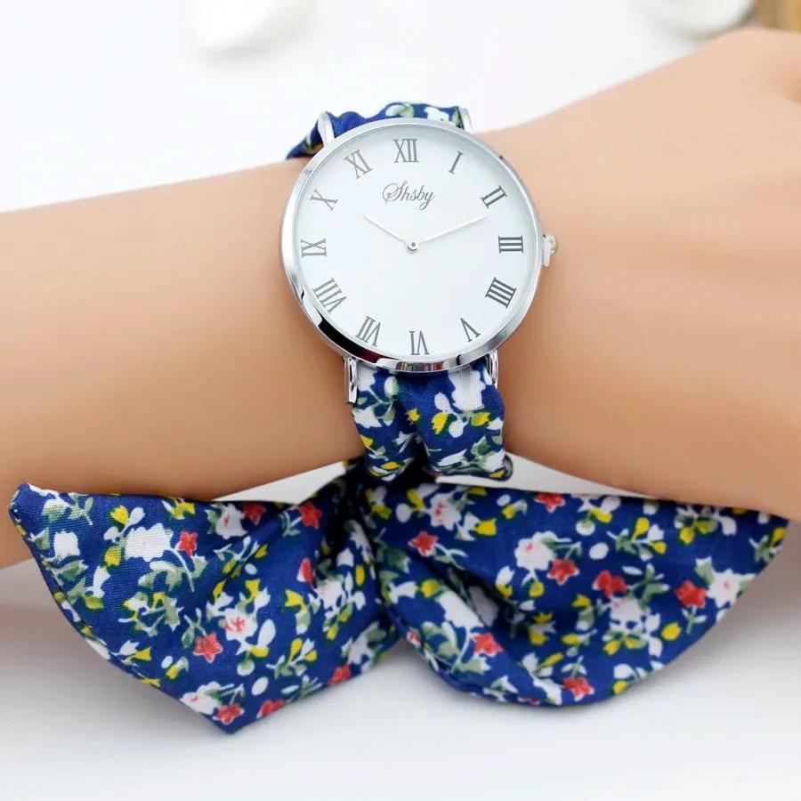 Shsby Brand New Lady Flower Cloth Wristwatch Roman Silver Women Dress Watch High Quality Fabric Watch Sweet Girls Bracelet Watch by Equanimity Essence.