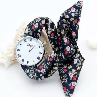 Shsby Brand New Lady Flower Cloth Wristwatch Roman Silver Women Dress Watch High Quality Fabric Watch Sweet Girls Bracelet Watch by Equanimity Essence.