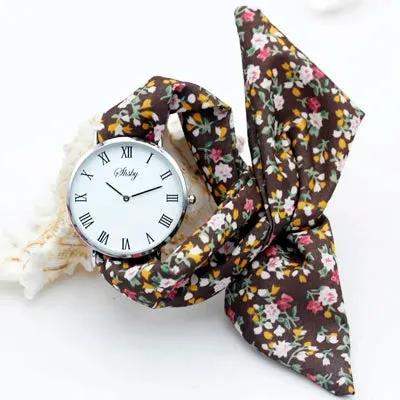 Shsby Brand New Lady Flower Cloth Wristwatch Roman Silver Women Dress Watch High Quality Fabric Watch Sweet Girls Bracelet Watch by Equanimity Essence.