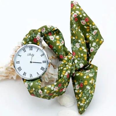 Shsby Brand New Lady Flower Cloth Wristwatch Roman Silver Women Dress Watch High Quality Fabric Watch Sweet Girls Bracelet Watch by Equanimity Essence.