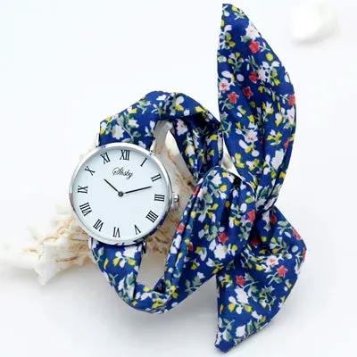 Shsby Brand New Lady Flower Cloth Wristwatch Roman Silver Women Dress Watch High Quality Fabric Watch Sweet Girls Bracelet Watch by Equanimity Essence.