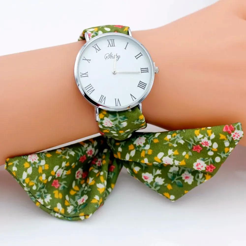 Shsby Brand New Lady Flower Cloth Wristwatch Roman Silver Women Dress Watch High Quality Fabric Watch Sweet Girls Bracelet Watch by Equanimity Essence.