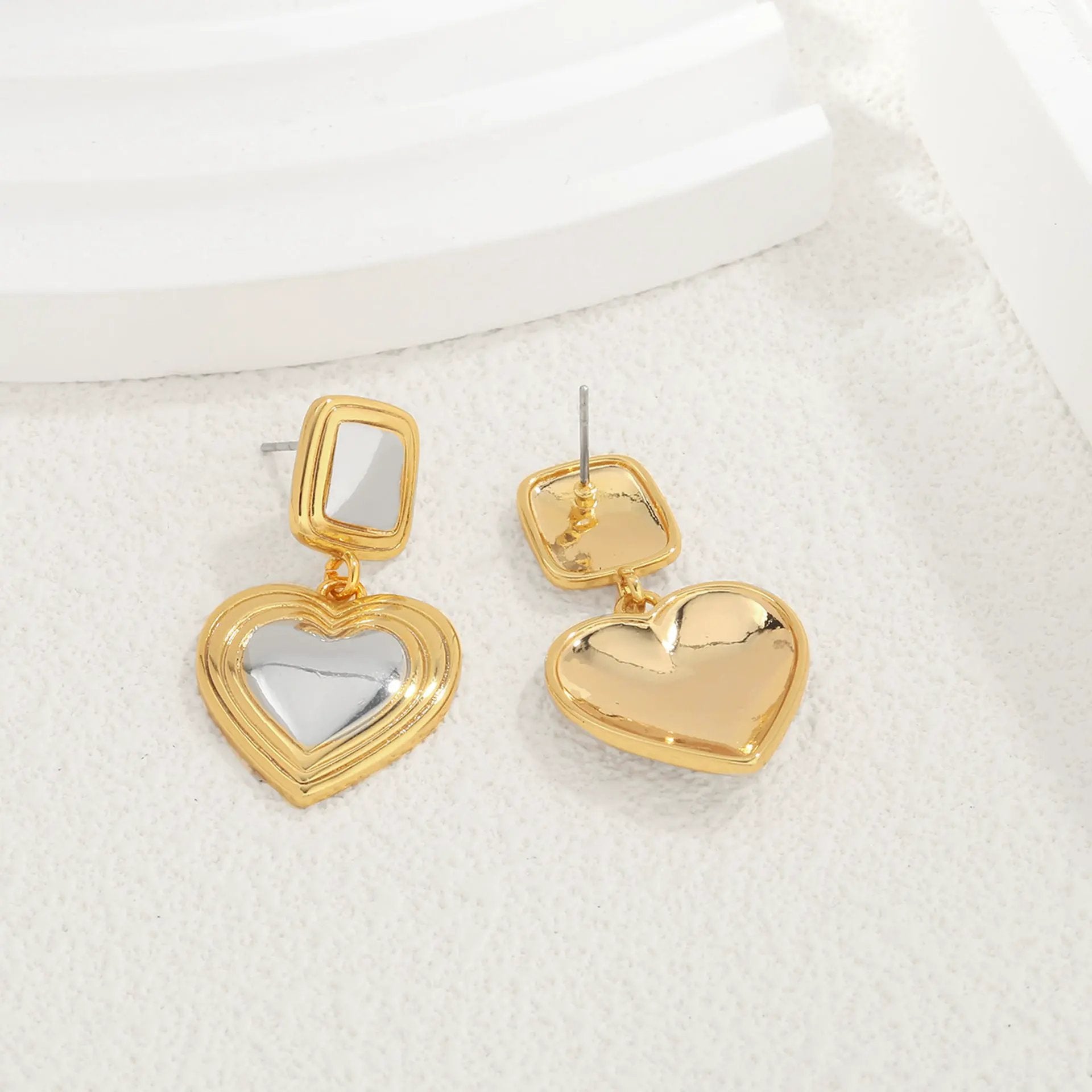 Light luxury fashion two tone earrings with a high-end feel, heart-shaped earrings with a heart shape, retro palace style peach heart earrings by Dropsure