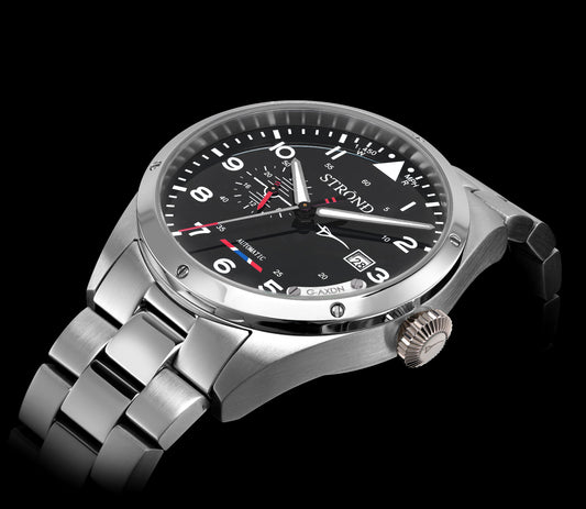 Silver wristwatch with a black dial on a black background