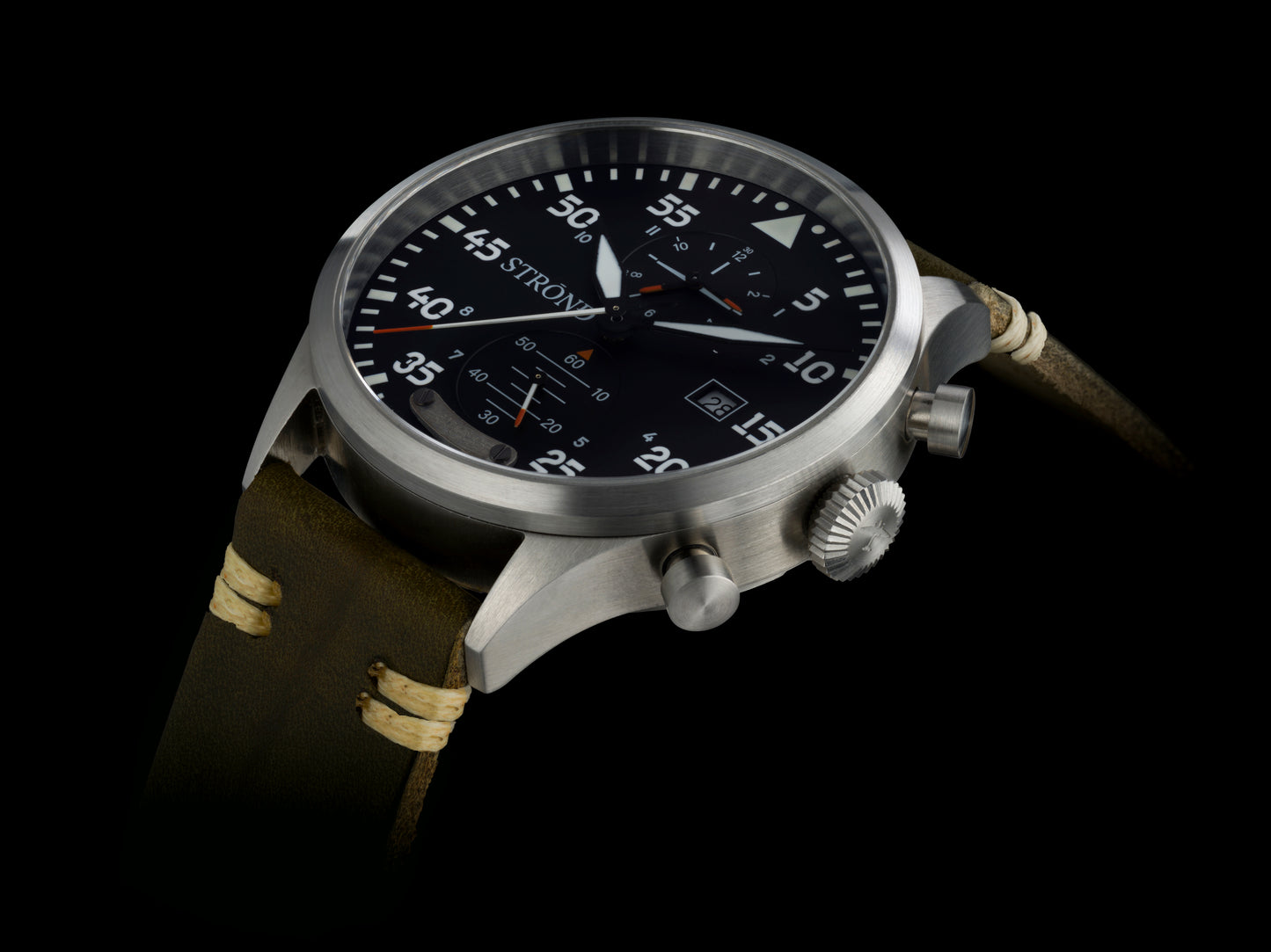 Wristwatch with detailed face and brown strap on black background