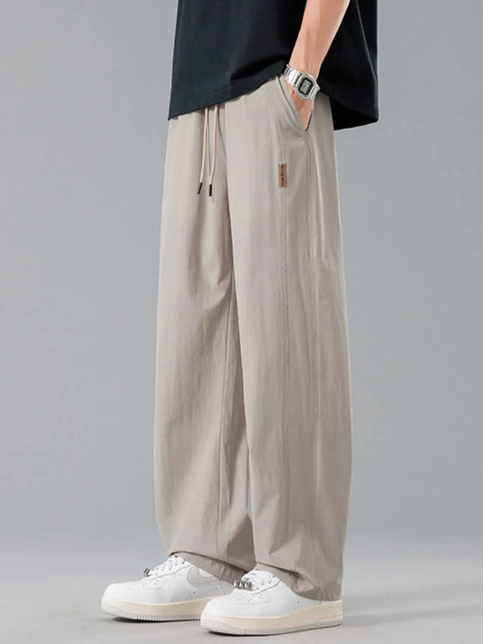 Men's Plus Size Loose Fit Drawstring Casual Pants by Trendsi