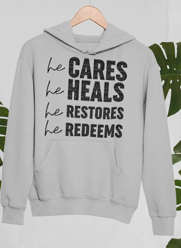 He Cares He Heals He Restores He Redeems Hoodie by Merch