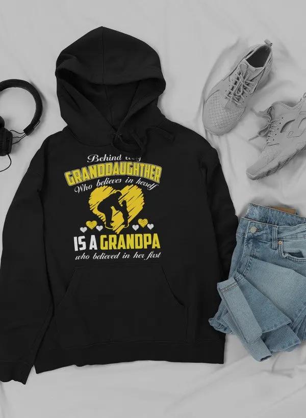 Behind Every Granddaughter Who Believes In Herself Is A Grandpa Hoodie by Merch